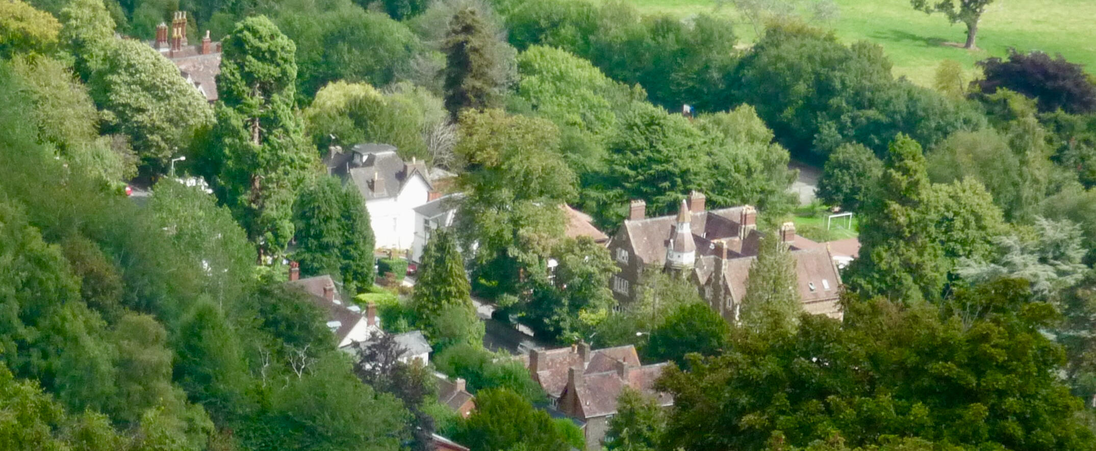 The Village of Malvern Wells by Fabian Musto, showing Abbey College’s main building with its iconic clock tower and adjacent boarding houses - Creative Commons Attribution-Share Alike 2.0 Generic license.